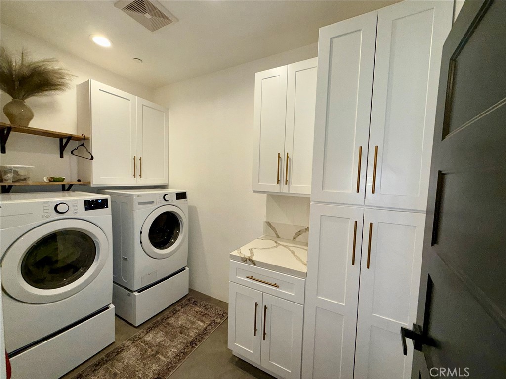 10773 Mills Road Apple Valley, CA 92308 - Photo 22 of 39 a utility room with sink dryer and washer