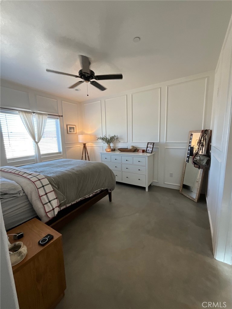 10773 Mills Road Apple Valley, CA 92308 - Photo 25 of 39 a bedroom with bed and window