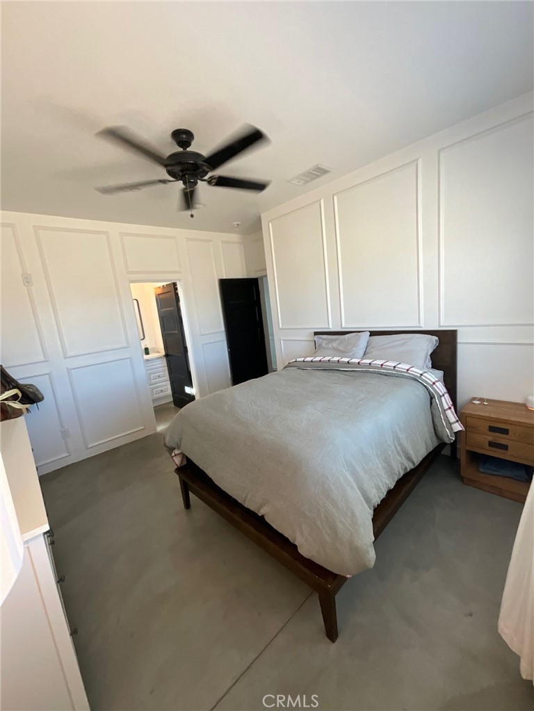 10773 Mills Road Apple Valley, CA 92308 - Photo 26 of 39 a bed sitting in a room next to a window