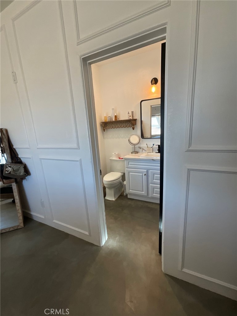 10773 Mills Road Apple Valley, CA 92308 - Photo 27 of 39 a bathroom with a toilet sink and tub