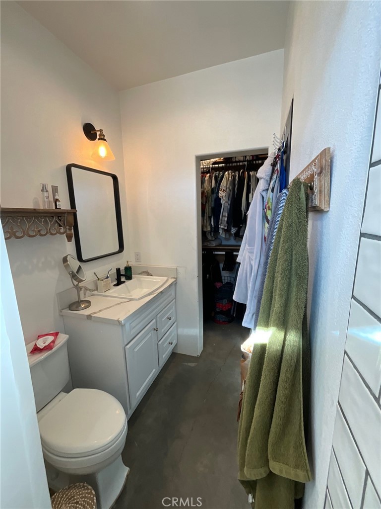 10773 Mills Road Apple Valley, CA 92308 - Photo 29 of 39 a bathroom with a toilet sink and tub