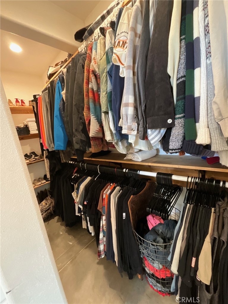 10773 Mills Road Apple Valley, CA 92308 - Photo 30 of 39 a view of walk in closet with clothes