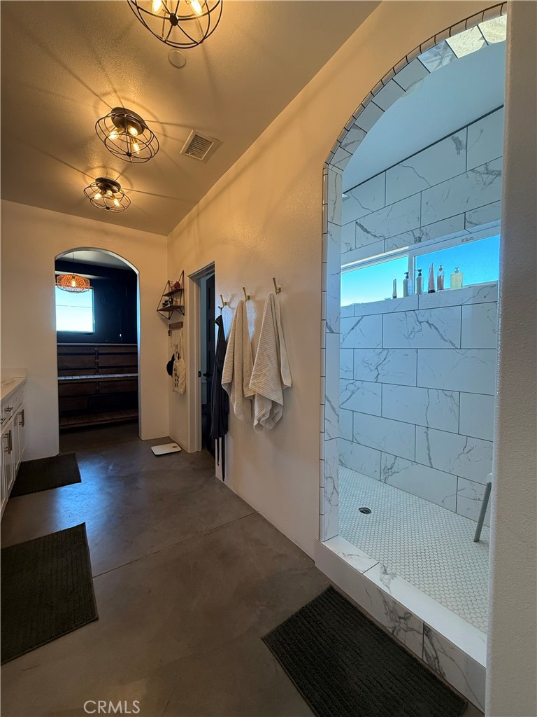 10773 Mills Road Apple Valley, CA 92308 - Photo 37 of 39 a bathroom with a bathtub and a shower