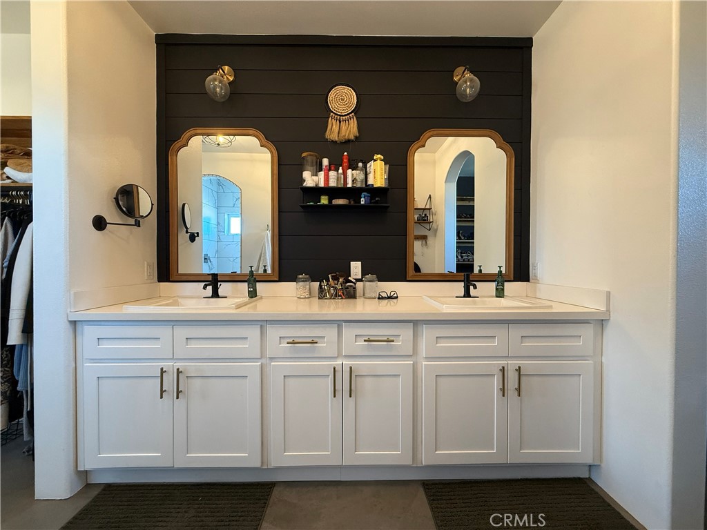 10773 Mills Road Apple Valley, CA 92308 - Photo 38 of 39 a bathroom with a double vanity sink and a mirror
