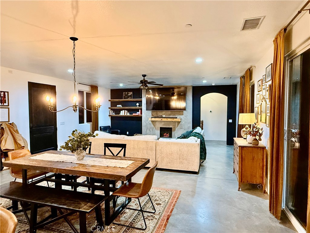 10773 Mills Road Apple Valley, CA 92308 - Photo 10 of 39 a view of a dining room with furniture