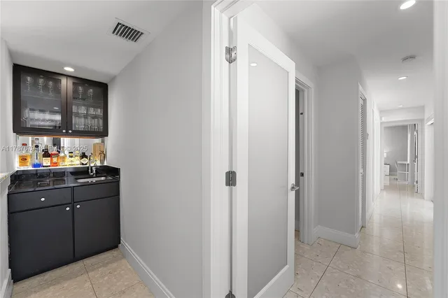 a view of a kitchen from the hallway