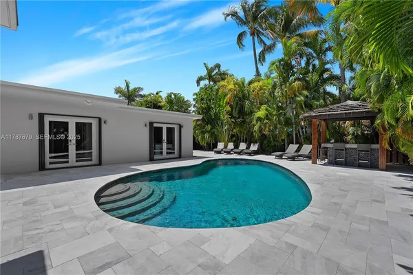a view of a swimming pool with a patio