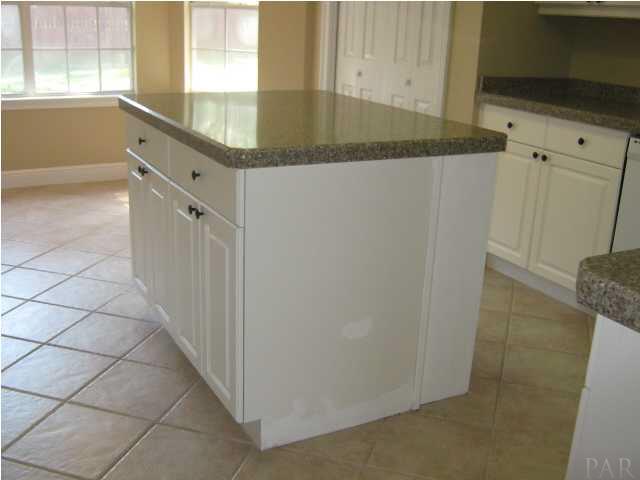 3041 Red Fern Road Cantonment, FL 32533 - Photo 14 of 25 Center island and tile flooring