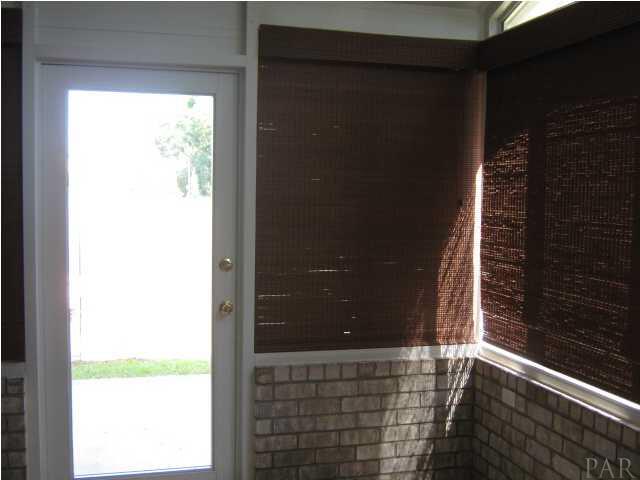 3041 Red Fern Road Cantonment, FL 32533 - Photo 22 of 25 Florida room with vertical slider windows and heated and cooled