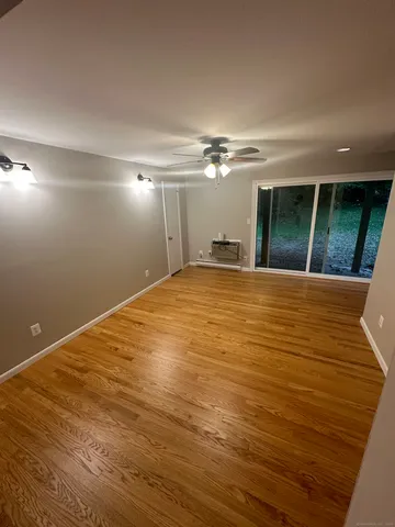 a view of empty room with floor to ceiling window