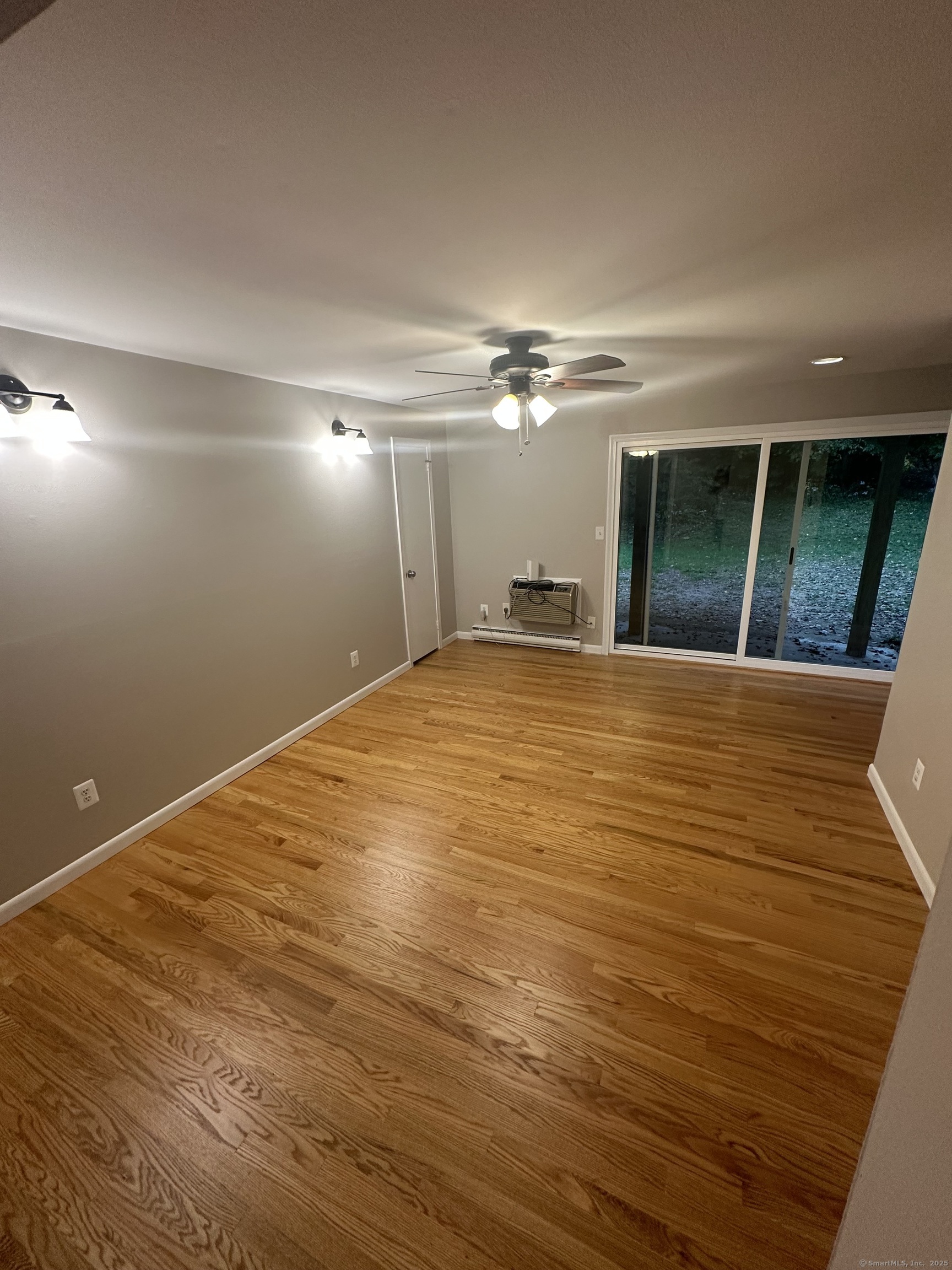 a view of empty room with floor to ceiling window