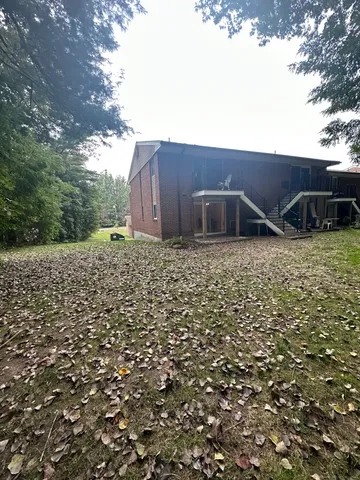 a backyard of a house with lots of green space