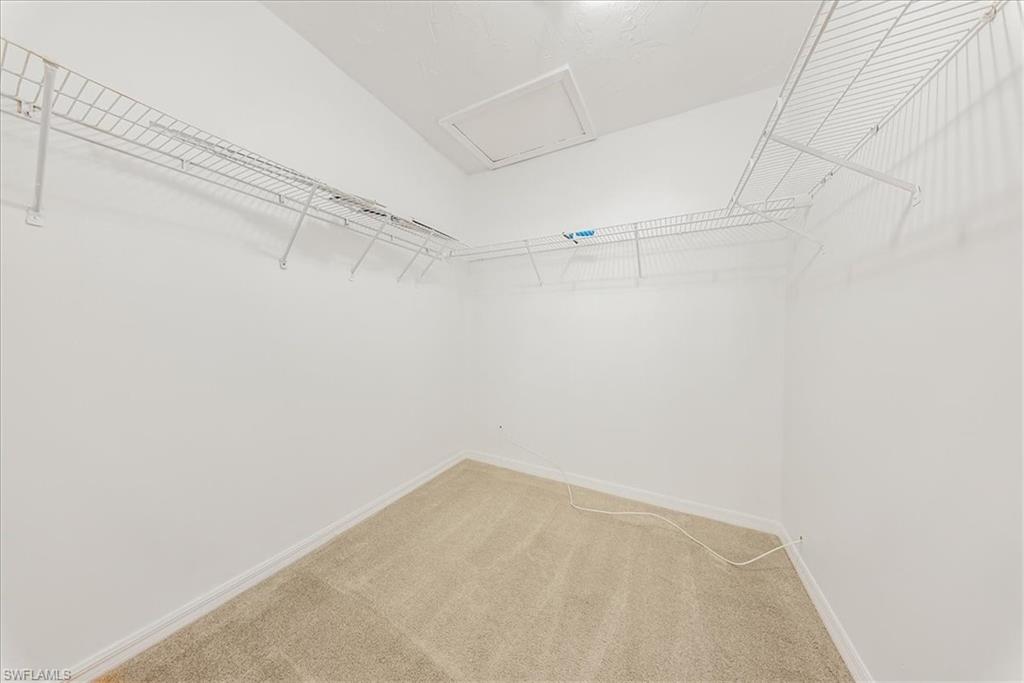 230 Timber Lake Circle, Unit C204 Naples, FL 34104 - Photo 11 of 30 a view of a room with racks on the wall