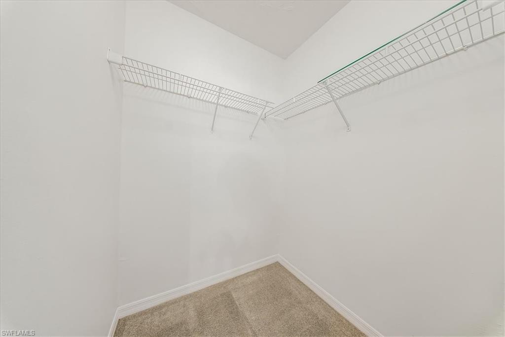 230 Timber Lake Circle, Unit C204 Naples, FL 34104 - Photo 18 of 30 a view of a room with racks on the wall