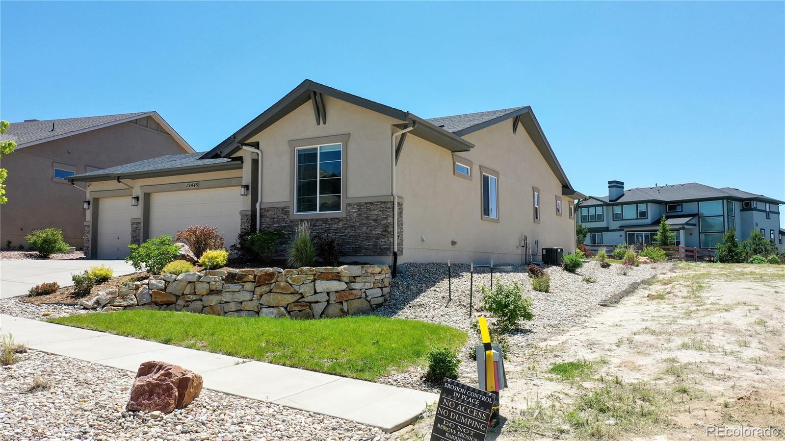 a front view of house with yard and outdoor seating