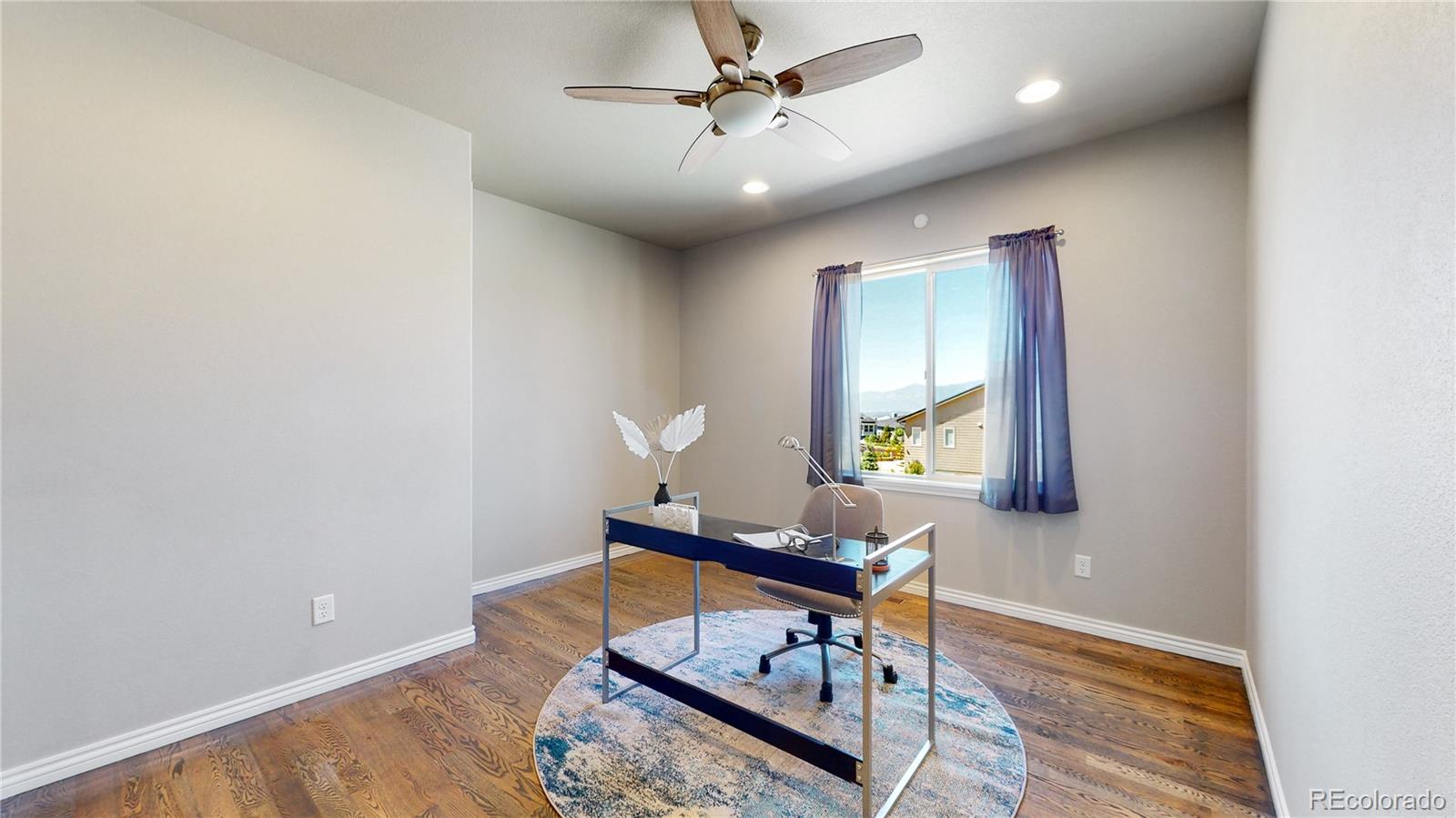 12449 Carmel Ridge Road Colorado Springs, CO 80921 - Photo 15 of 40 a living room with furniture and a window