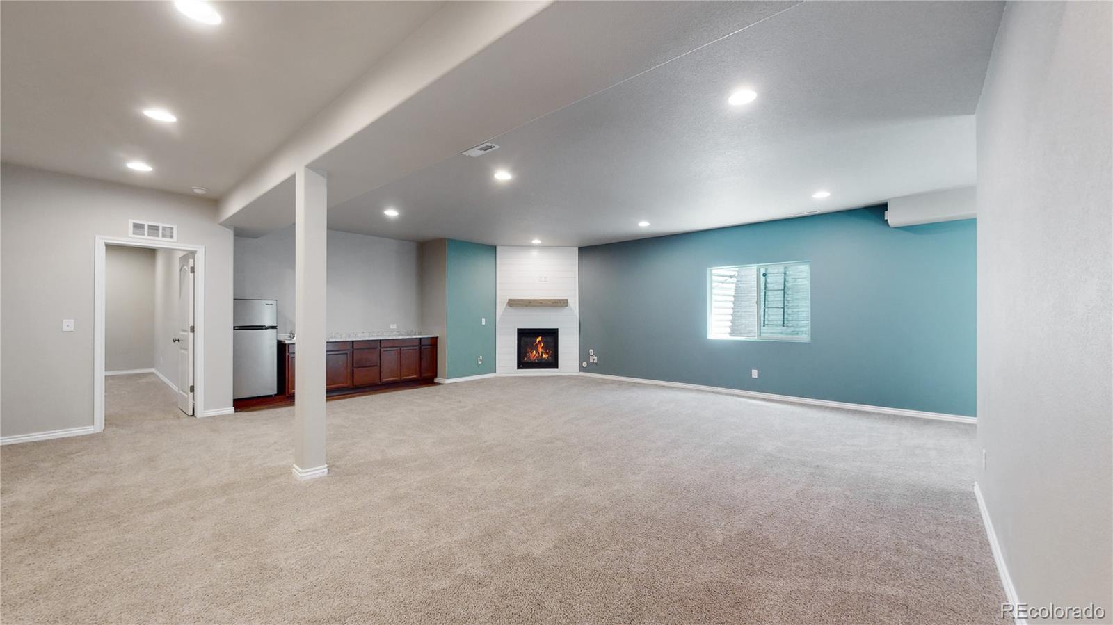 12449 Carmel Ridge Road Colorado Springs, CO 80921 - Photo 26 of 40 an empty room with windows and entrance