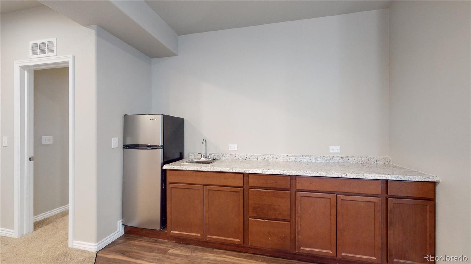 12449 Carmel Ridge Road Colorado Springs, CO 80921 - Photo 30 of 40 a bathroom with a sink and a mirror