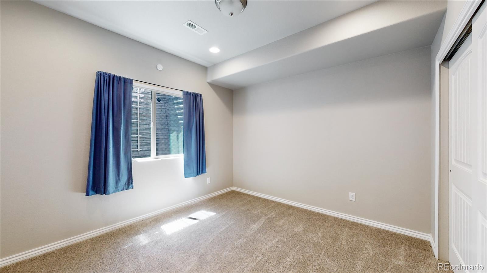 12449 Carmel Ridge Road Colorado Springs, CO 80921 - Photo 34 of 40 an empty room with windows