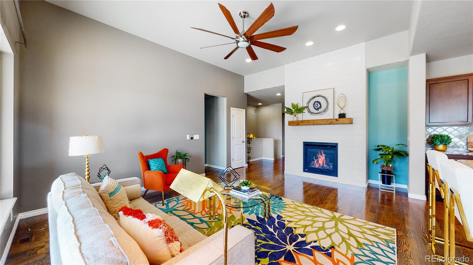 12449 Carmel Ridge Road Colorado Springs, CO 80921 - Photo 5 of 40 a living room with furniture and a fireplace