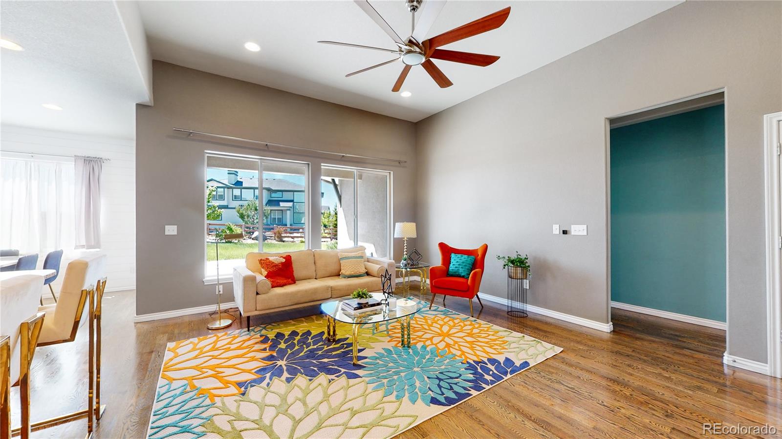 12449 Carmel Ridge Road Colorado Springs, CO 80921 - Photo 6 of 40 a living room with furniture rug and window