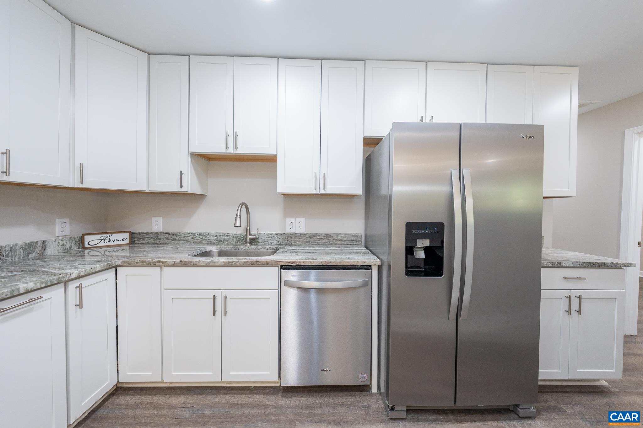1861 Woodburn Road Charlottesville, VA 22901 - Photo 18 of 42 a kitchen with stainless steel appliances granite countertop a refrigerator sink and cabinets