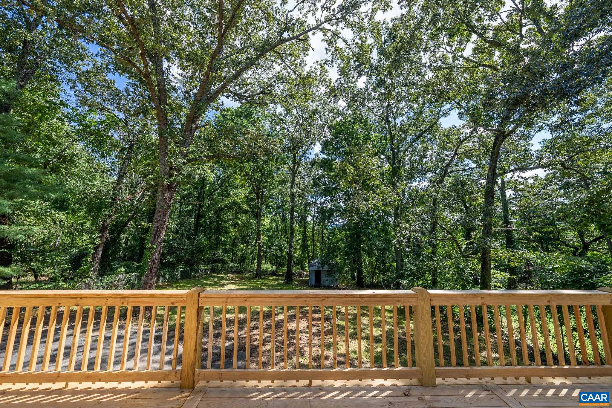 1861 Woodburn Road Charlottesville, VA 22901 - Photo 36 of 42 a view of a wooden deck and trees