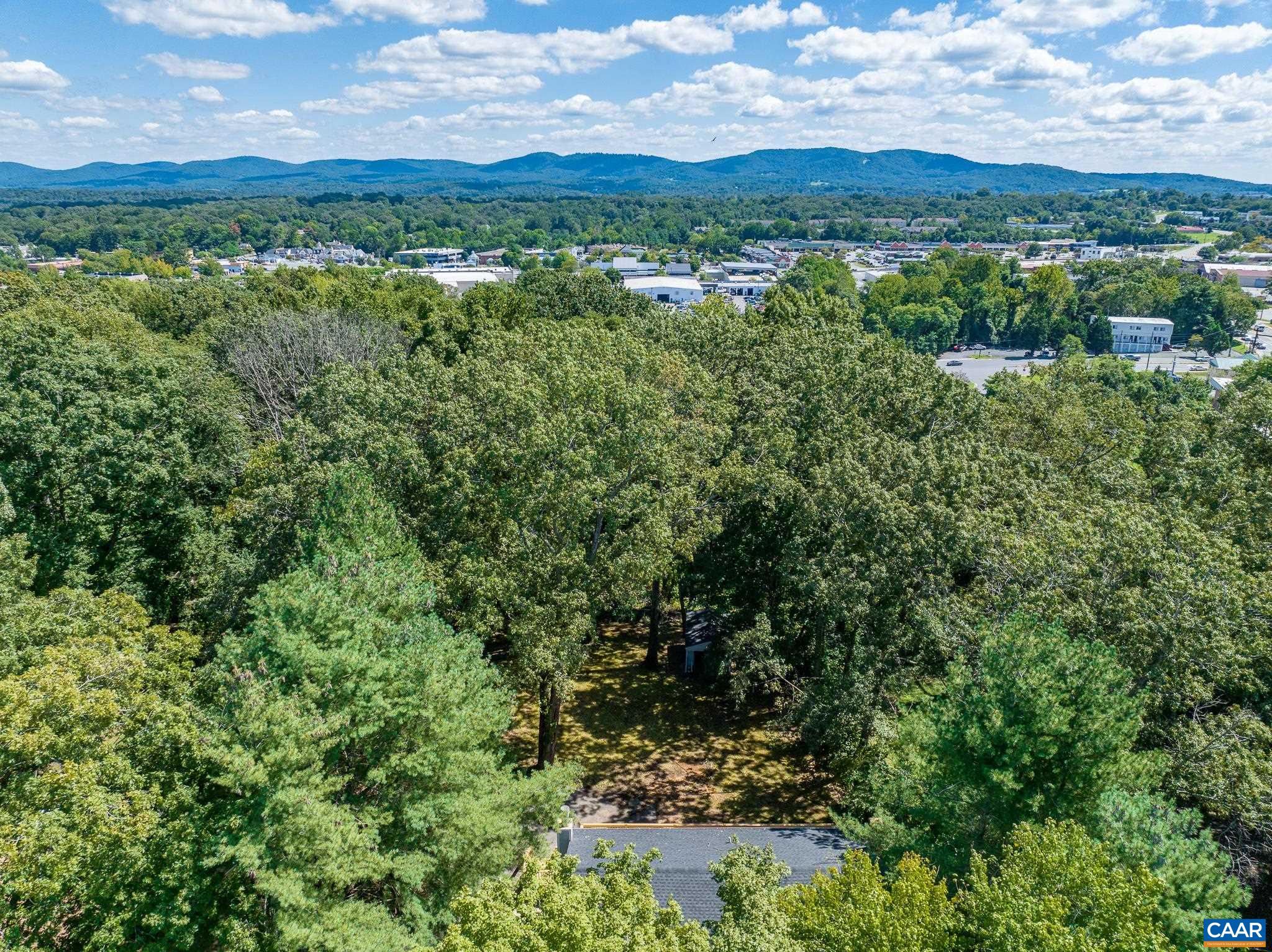 1861 Woodburn Road Charlottesville, VA 22901 - Photo 4 of 42 an aerial view of residential houses with outdoor space and trees