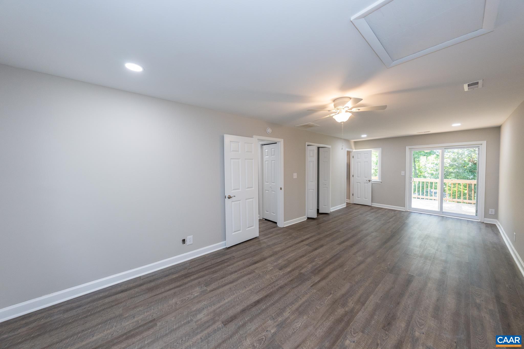 1861 Woodburn Road Charlottesville, VA 22901 - Photo 5 of 42 wooden floor in an empty room with a window