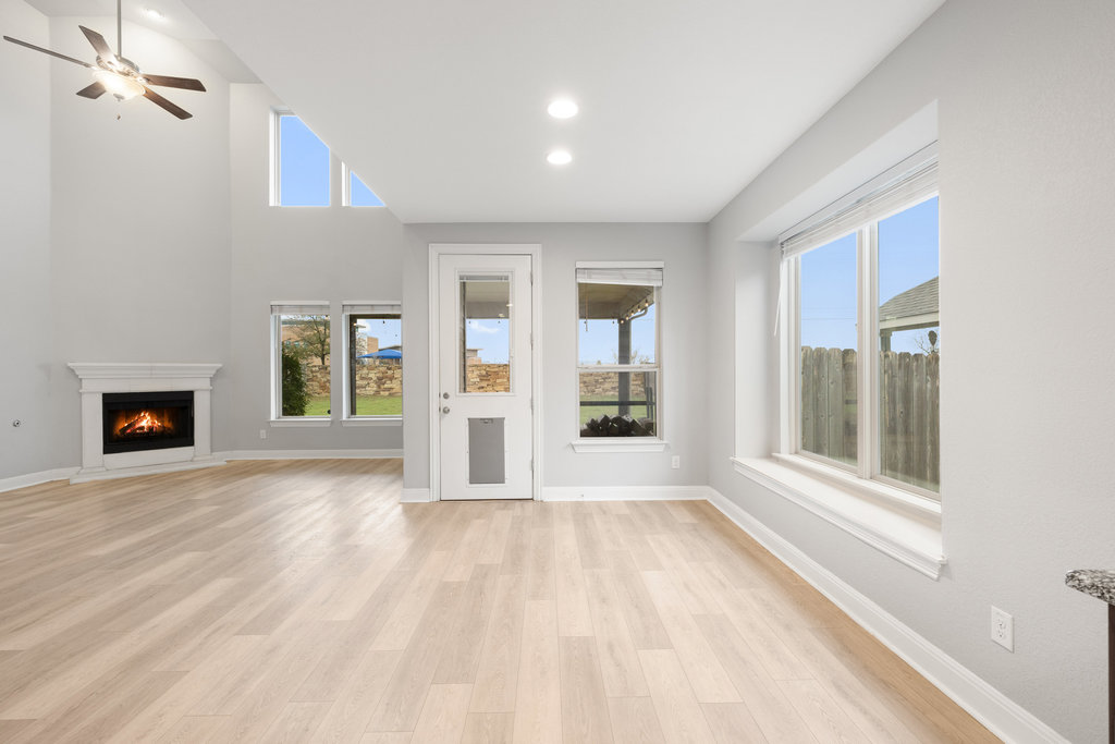 5208 Anaheim Avenue Pflugerville, TX 78660 - Photo 15 of 38 a view of an empty room with a window and fire place