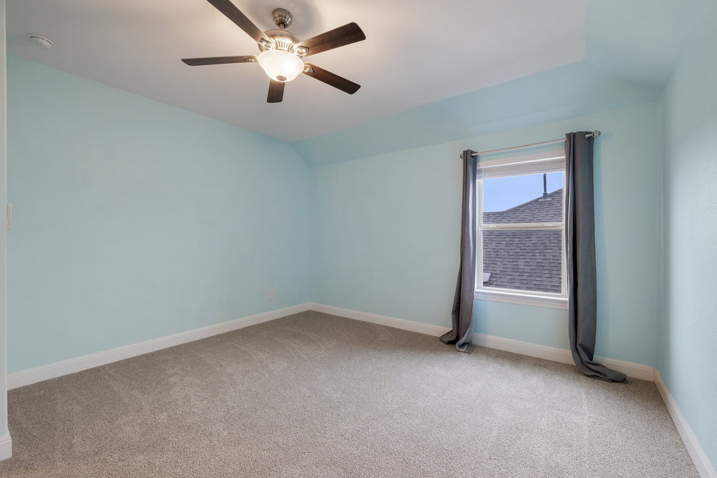 5208 Anaheim Avenue Pflugerville, TX 78660 - Photo 29 of 38 an empty room with a fan & a window