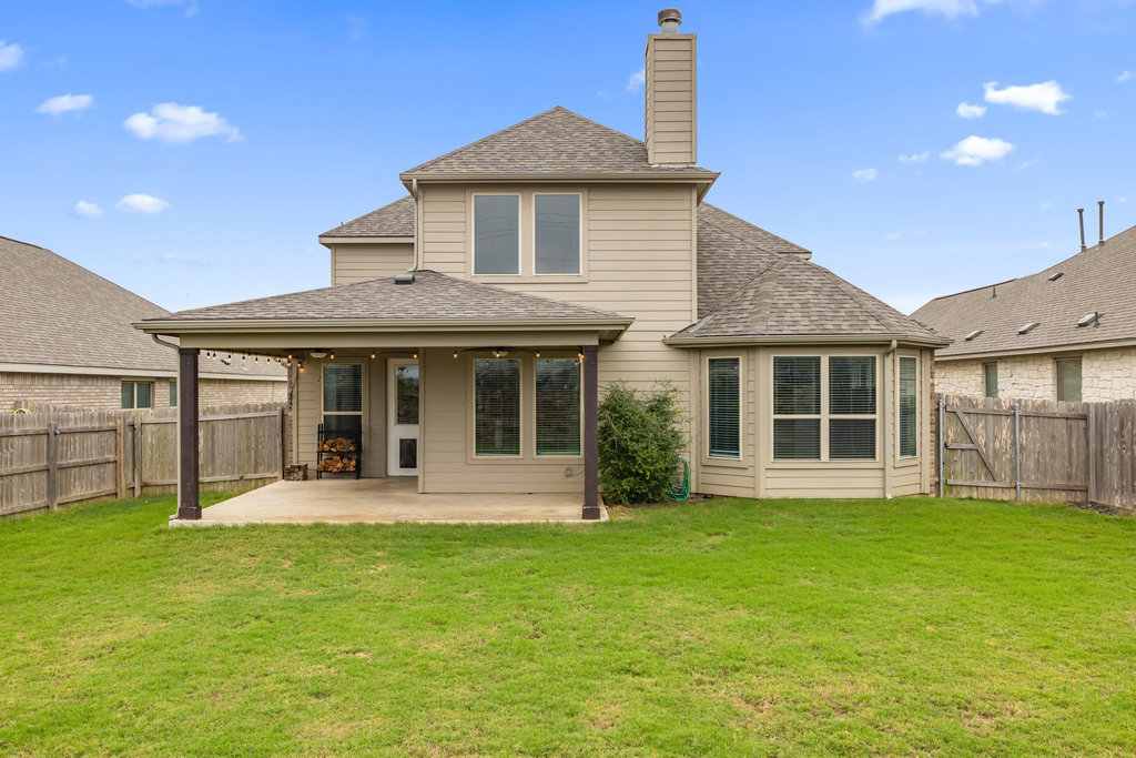 5208 Anaheim Avenue Pflugerville, TX 78660 - Photo 34 of 38 a front view of a house with a yard and porch