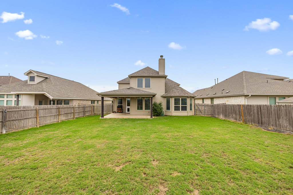 5208 Anaheim Avenue Pflugerville, TX 78660 - Photo 35 of 38 a view of a big house with a big yard and large trees