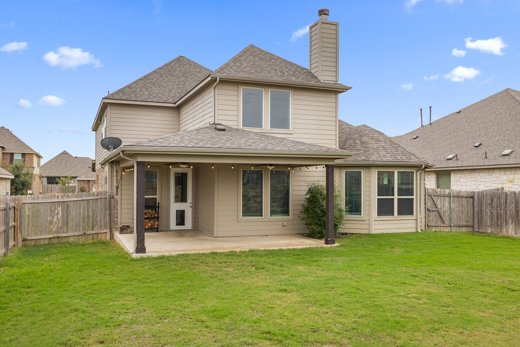 5208 Anaheim Avenue Pflugerville, TX 78660 - Photo 36 of 38 a view of a house with a yard