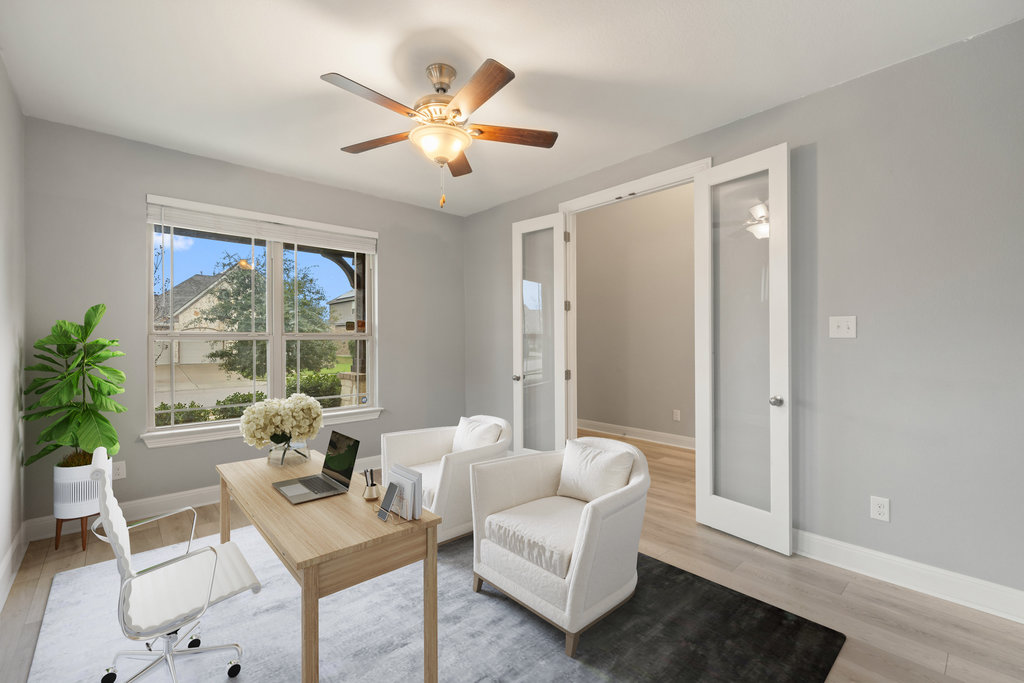 5208 Anaheim Avenue Pflugerville, TX 78660 - Photo 5 of 38 a living room with furniture and a large window