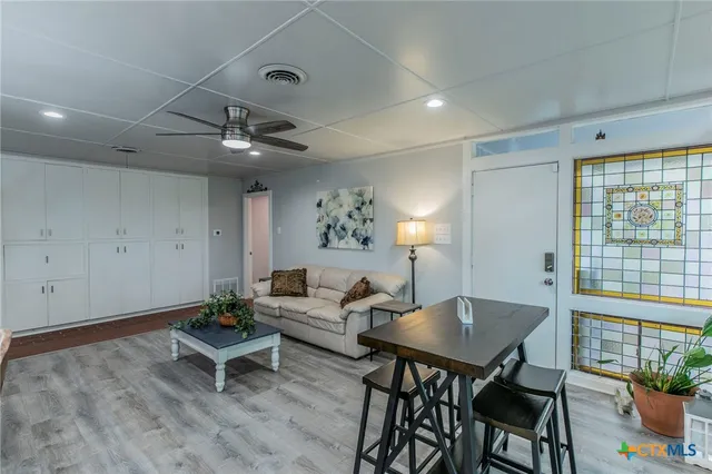 a living room with furniture and a window