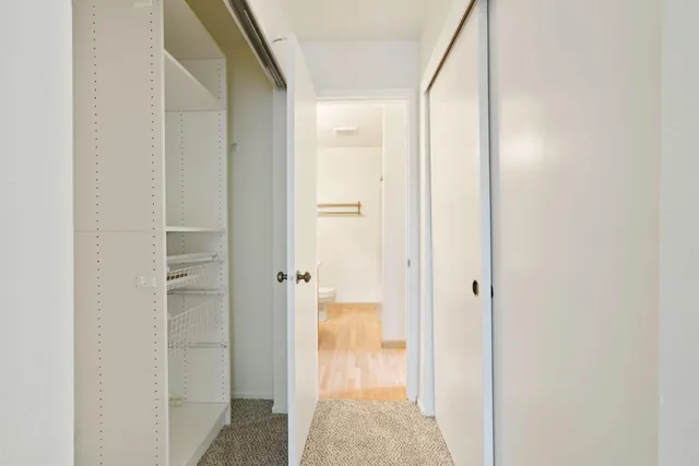 a view of a bathroom from a hallway