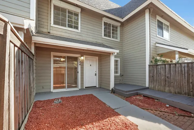 a view of a house with a door and wooden floor