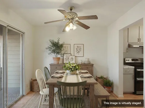 a view of a dining room with furniture and wooden floor