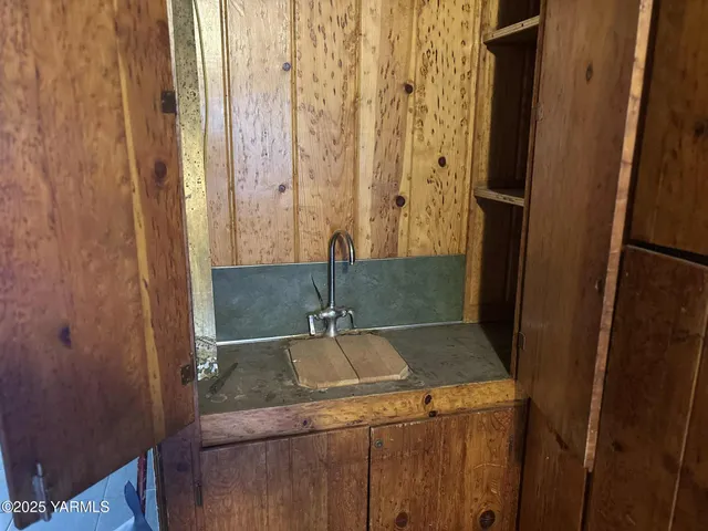 a bathroom with a sink and vanity