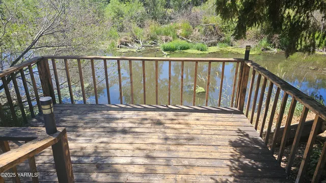 a balcony with wooden floor