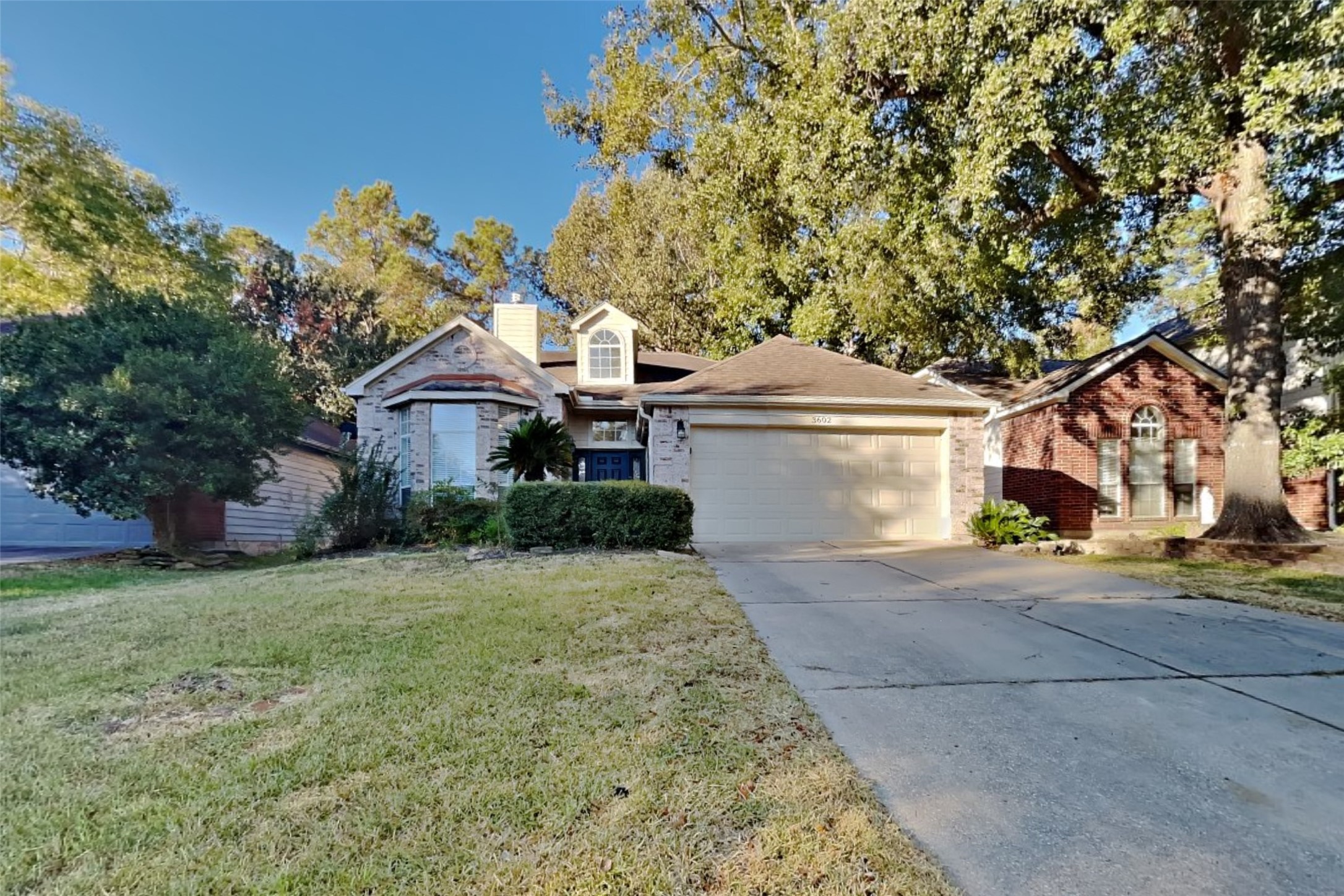 3602 Appalachian Trail Houston, TX 77345 - Photo 1 of 21 a front view of a house with a garden and tree