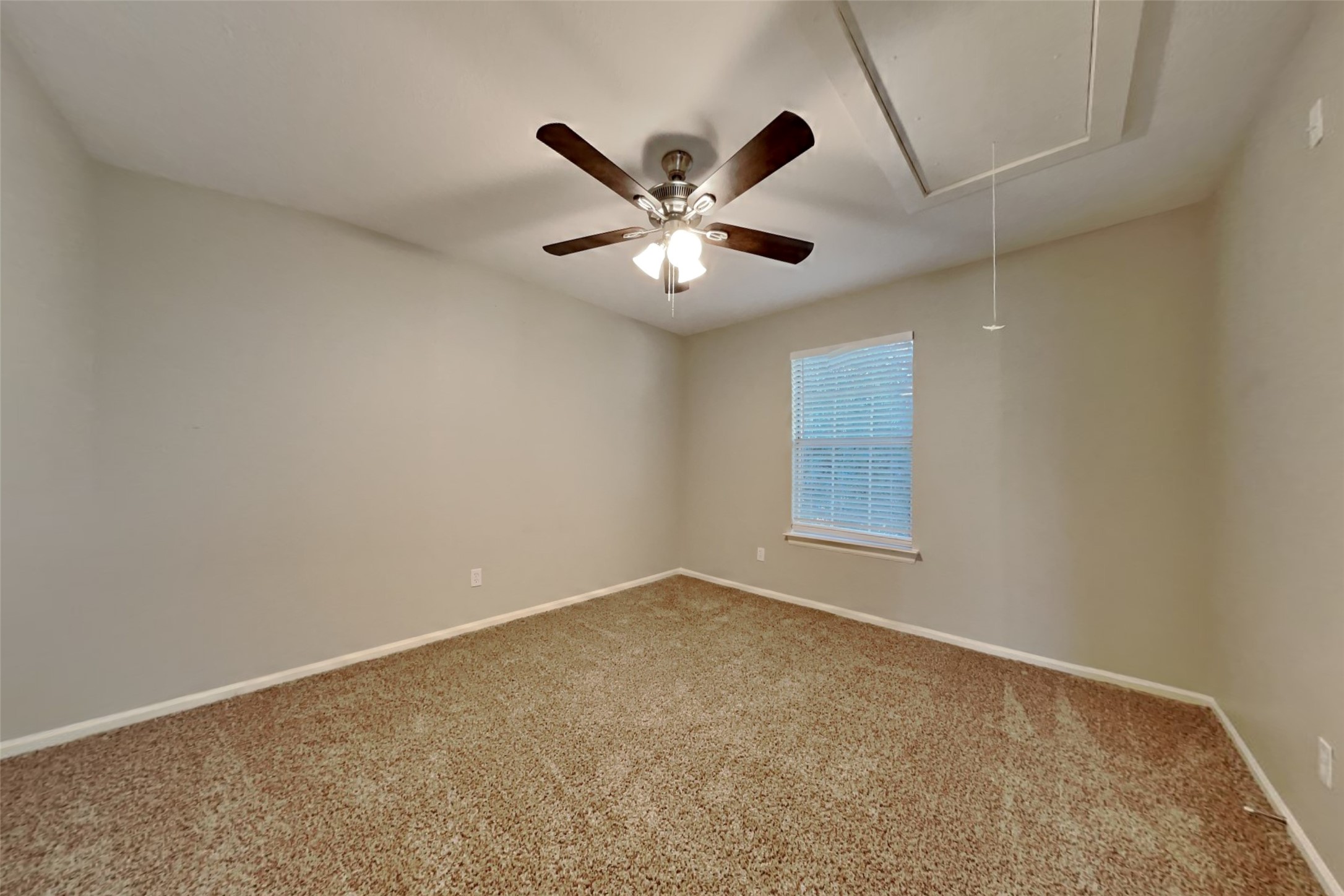 3602 Appalachian Trail Houston, TX 77345 - Photo 13 of 21 an empty room with a window and a ceiling fan