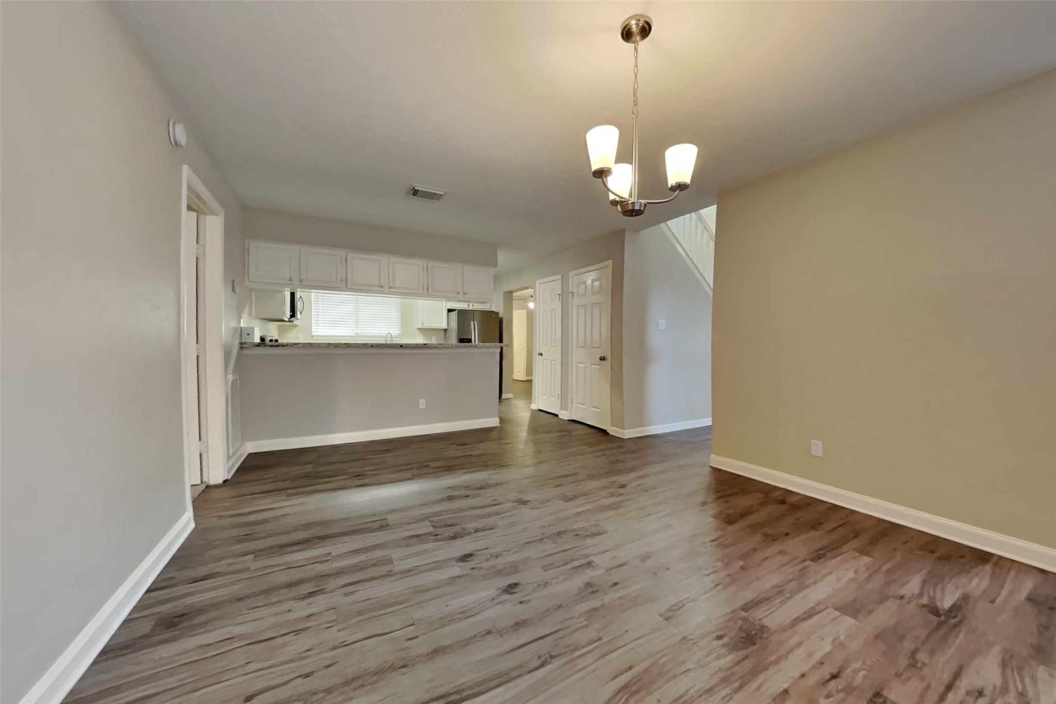3602 Appalachian Trail Houston, TX 77345 - Photo 8 of 21 a view of a room with wooden floor and kitchen view