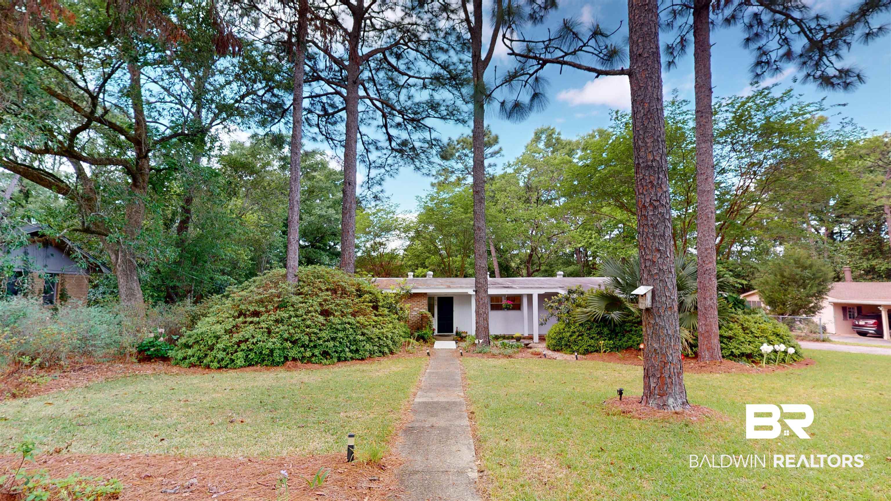1075 Zurich Street Mobile, AL 36608 - Photo 3 of 35 Single story home with a front lawn and view of scattered trees