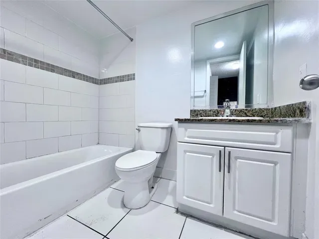 a bathroom with a sink a toilet and a bathtub
