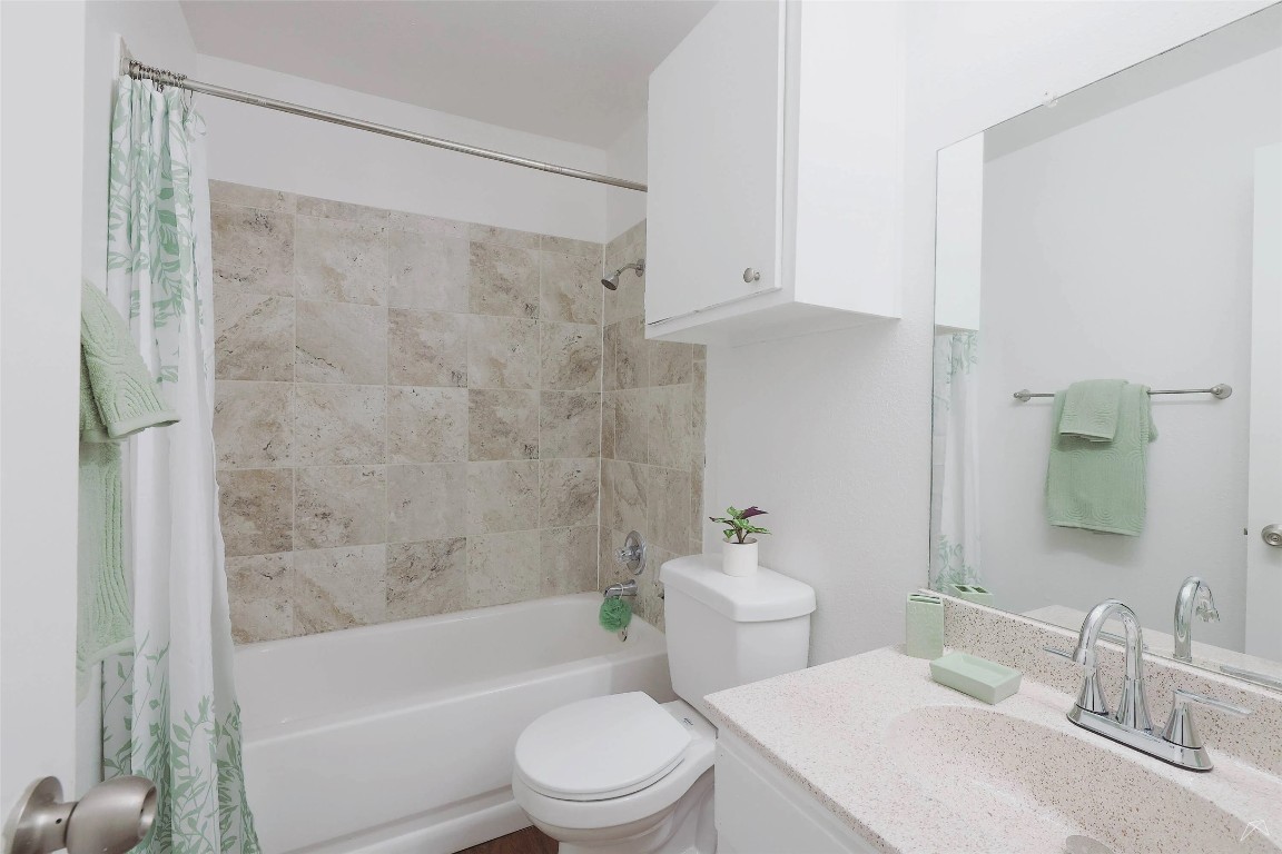 2323 Wells Branch Parkway, Unit C102 Austin, TX 78728 - Photo 12 of 20 Bathroom featuring vanity and shower / bath combo