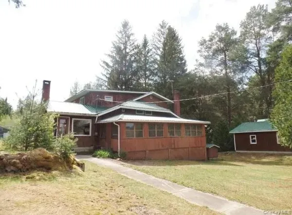 a view of house with yard and entertaining space