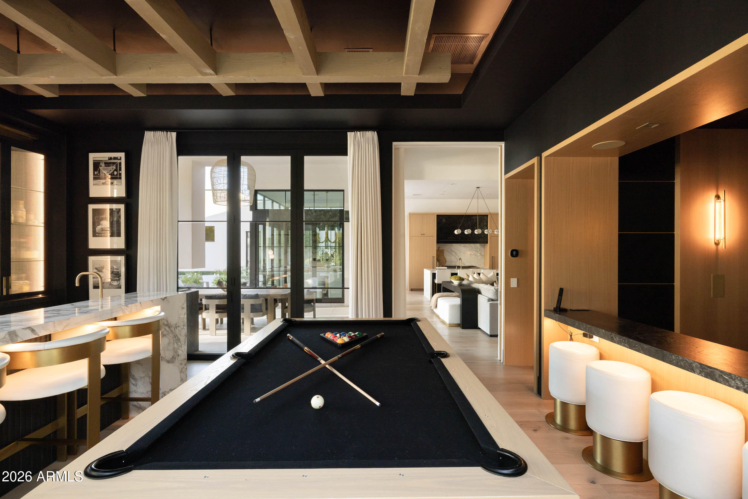 6800 North Mummy Mountain Road Paradise Valley, AZ 85253 - Photo 13 of 61 a living room with furniture pool table and large windows