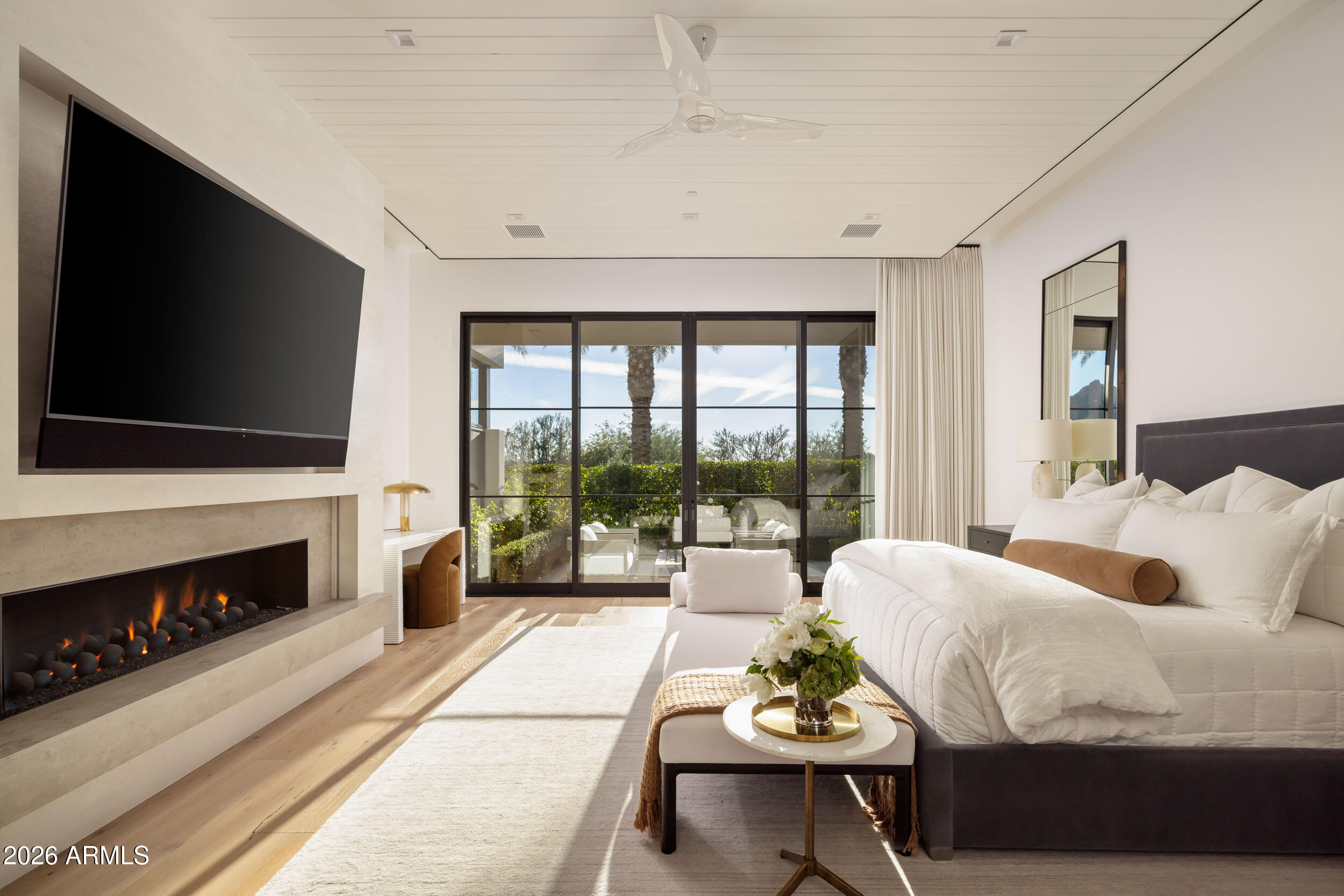 6800 North Mummy Mountain Road Paradise Valley, AZ 85253 - Photo 20 of 61 a living room with fireplace furniture and a flat screen tv